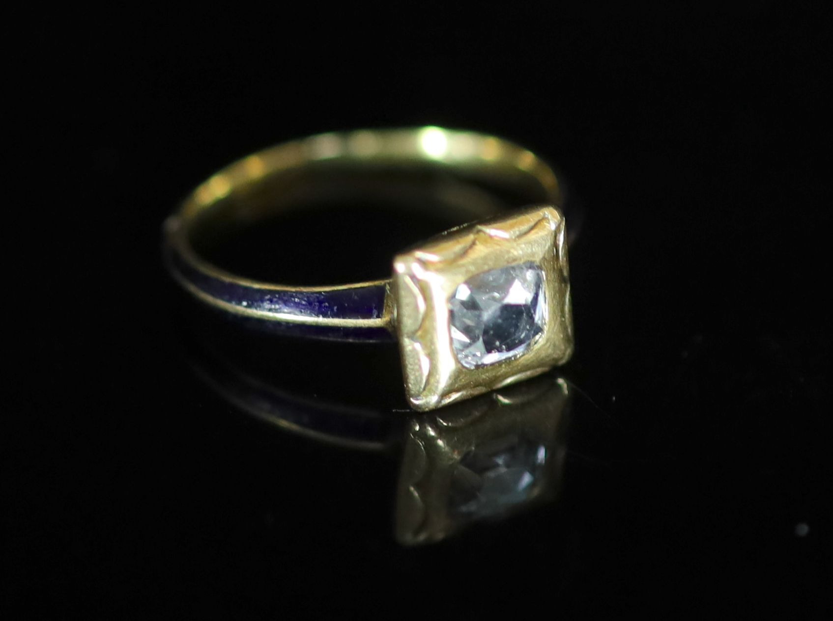 A 19th century gold, blue enamel and old mine cut diamond set ring